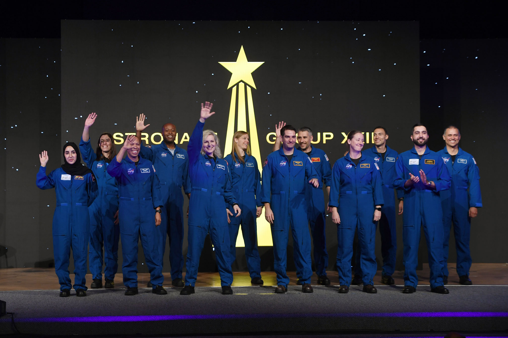 A picture containing person, group, posing, people

Description automatically generated